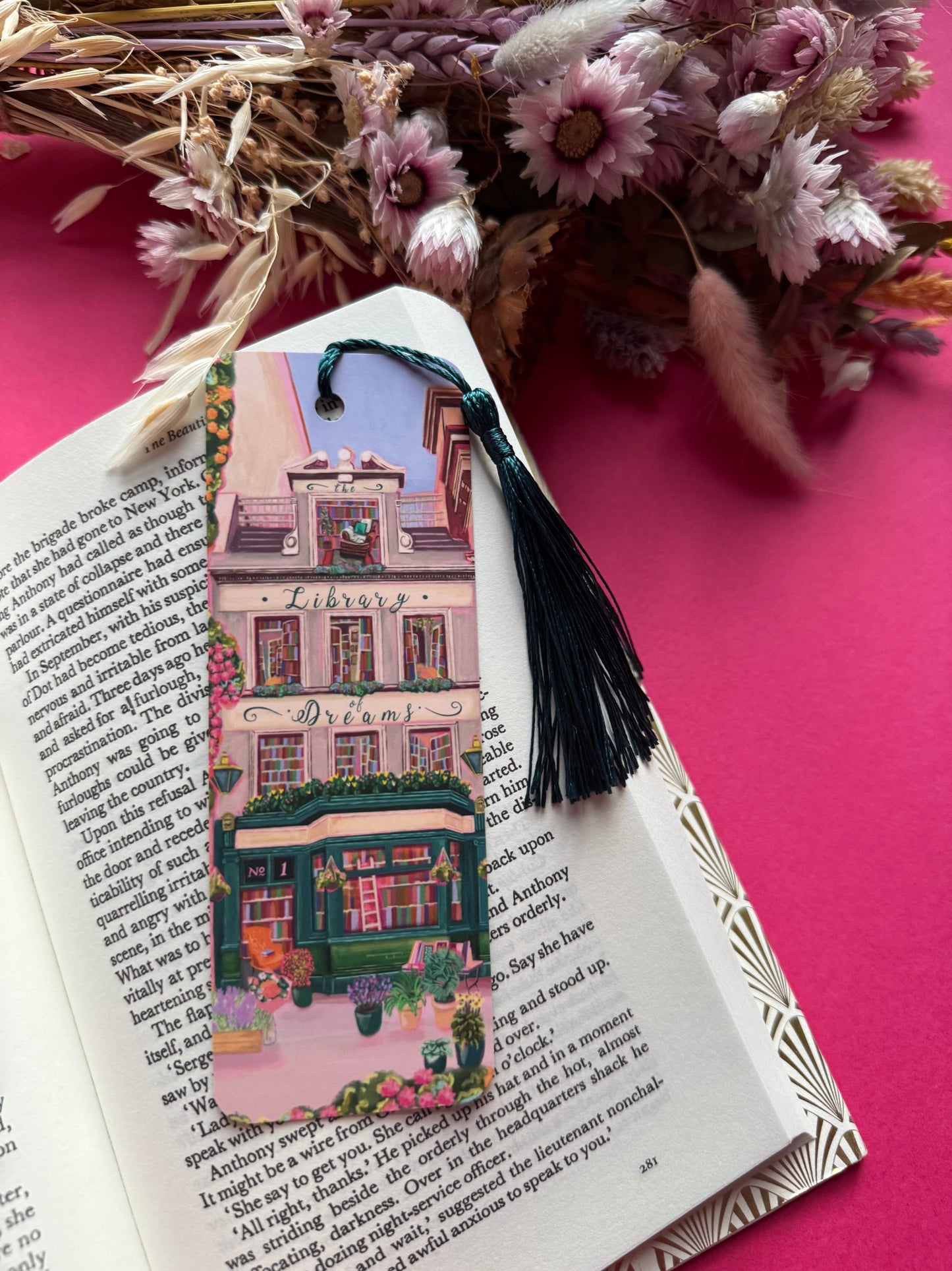 4 storey town house library with windows showing bookcases stacked full of books, covered with flowers & plants. A fantasy library perfect for cosying up with a good book designed by Rebecca Elizabeth Draws