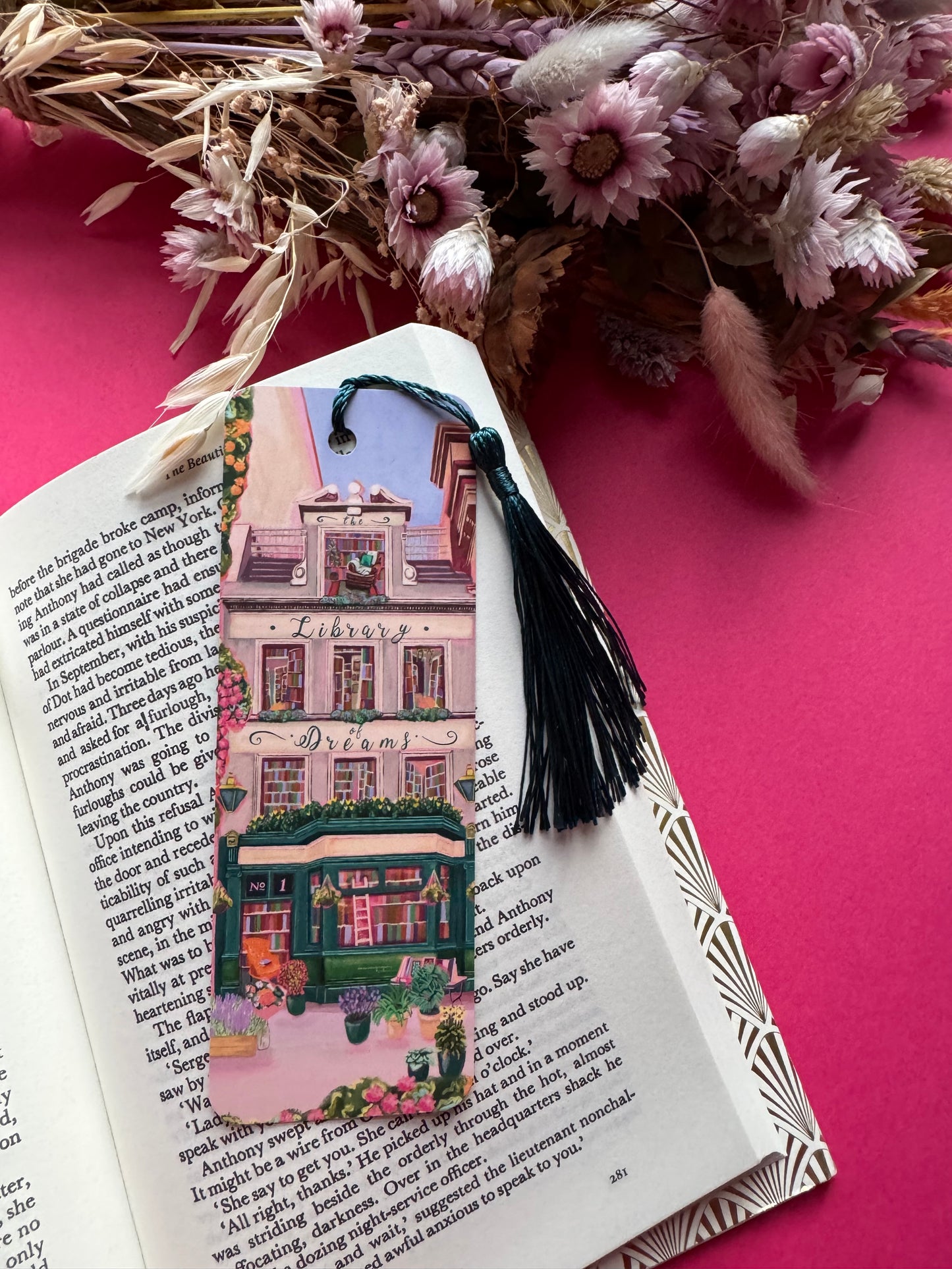 4 storey town house library with windows showing bookcases stacked full of books, covered with flowers & plants. A fantasy library perfect for cosying up with a good book designed by Rebecca Elizabeth Draws