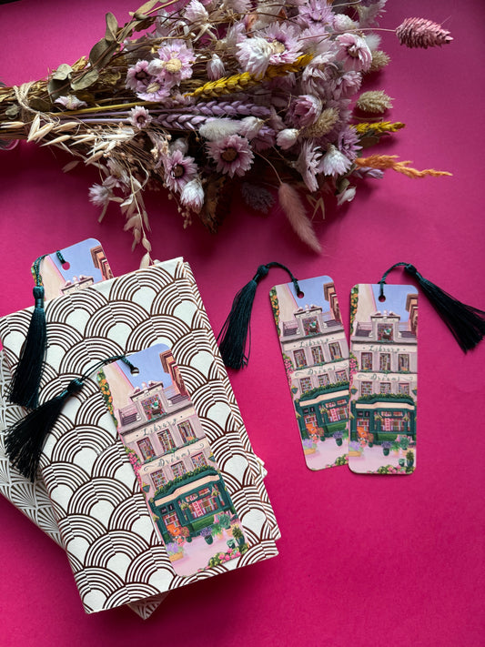 4 storey town house library with windows showing bookcases stacked full of books, covered with flowers & plants. A fantasy library perfect for cosying up with a good book designed by Rebecca Elizabeth Draws
