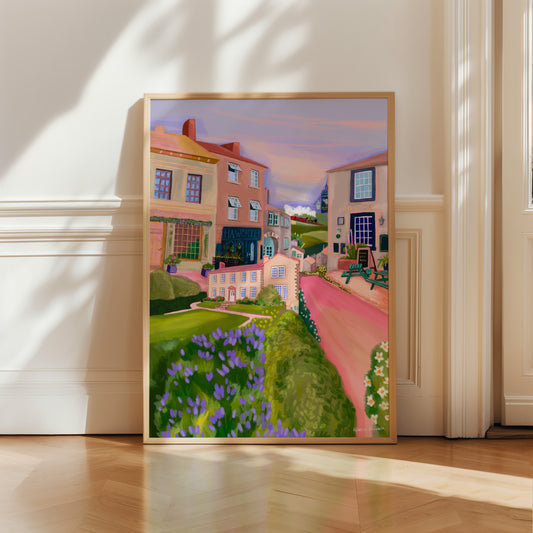 Haworth, the home to the Bronte sisters in Yorkshire. This illustration combines the quaint cobbled streets, the spectacular views across the moors and the Bronte’s family home which is now a museum. In the background there is an illustration of the local steam train that takes you through the Yorkshire countryside. This illustration is designed in soft pink, cream, and lilac colours. A small signature in white the corner. Designed by Rebecca Gibbs at Rebecca Elizabeth Draws.