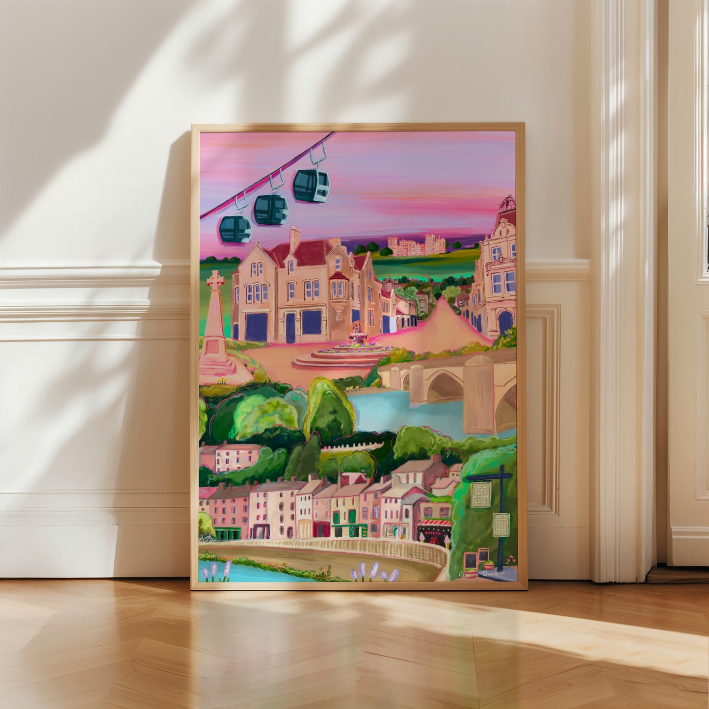 An illustration of Matlock bath and Matlock Derbyshire. Places included are the shops and amusement arcades of Matlock bath, the cable cars and the county offices of Matlock. The war memorial and Riber castle. All set against a pink and purple setting sun sky.
