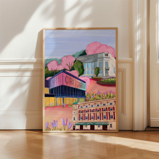 Sheffield theatres illustration, Crucible and Lyceum theatre are illustrated alongside Sheffield library on a background of pink and orange. Trees in both green and pink surround and a baby blue sky.