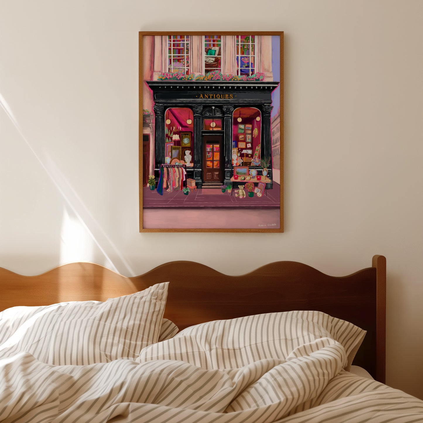Illustration of a antiques shop front in black with ornate designs, inside is pink and golden with vintage objects such a clocks, statues, picture frames. The illustration gives off dark academia vibes. Designed by Rebecca Elizabeth Draws.