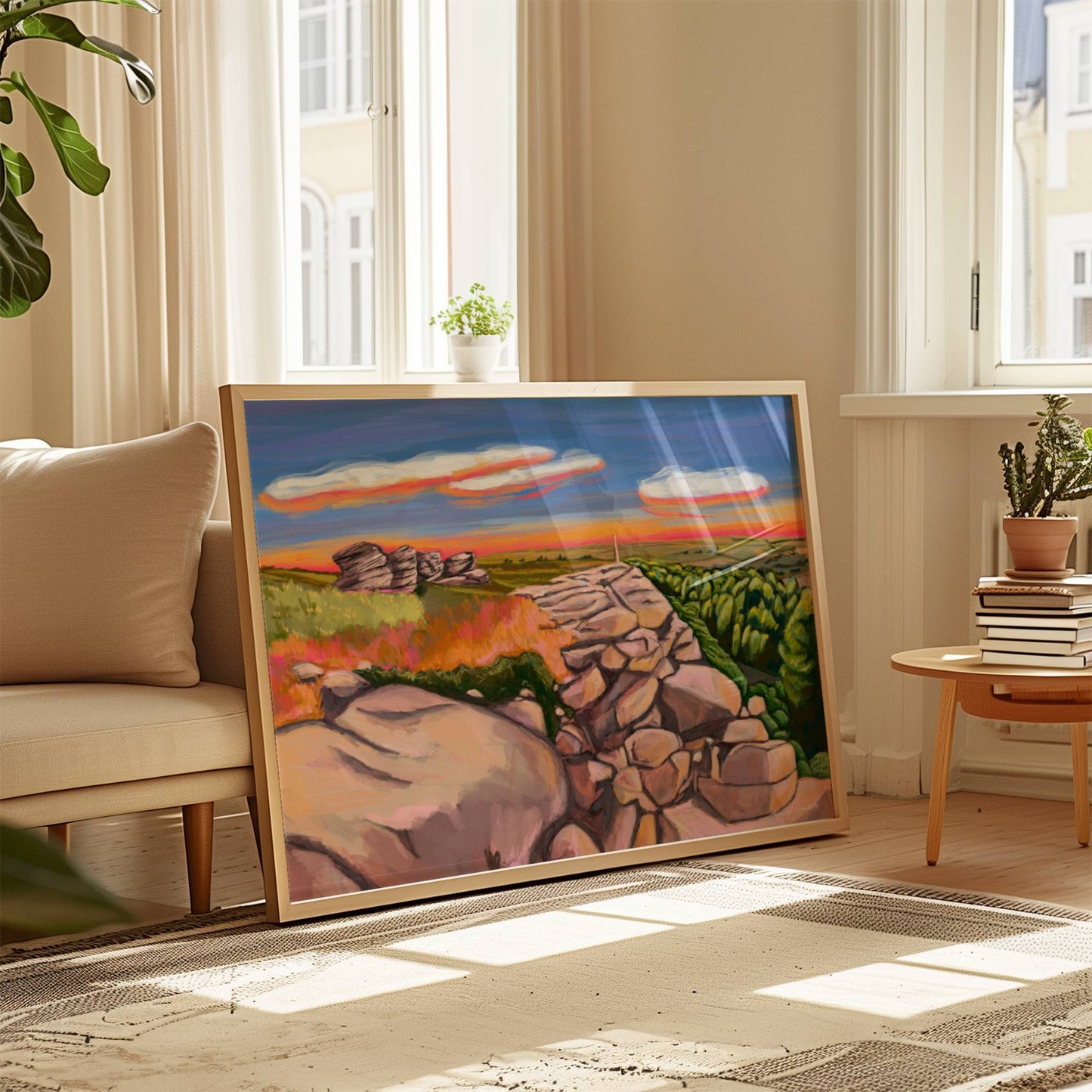 An illustration of Birchen Edge in the Peak District. With the rock face, rock outcrops named after ships from the battle of Trafalgar and Nelsons Monument all set against a sunset sky with blue, yellow, orange, and pink glow. Designed by Rebecca Elizabeth Draws