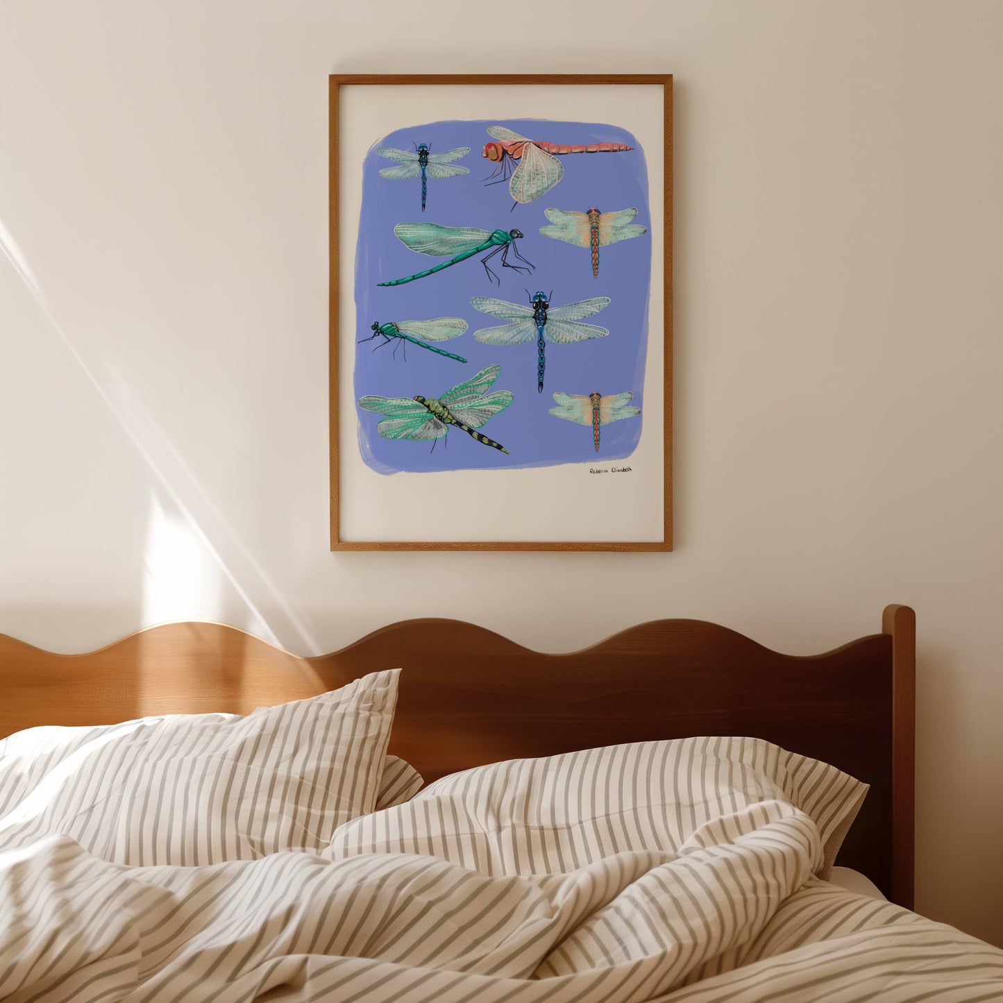 Hand painted dragonflies in gouache and edited digitally onto soft coloured blur backgrounds. Dragonflies in a flat lay composition with lots of intricate details featured. There is a small signature in black at the right. Designed by Rebecca Gibbs at Rebecca Elizabeth Draws.