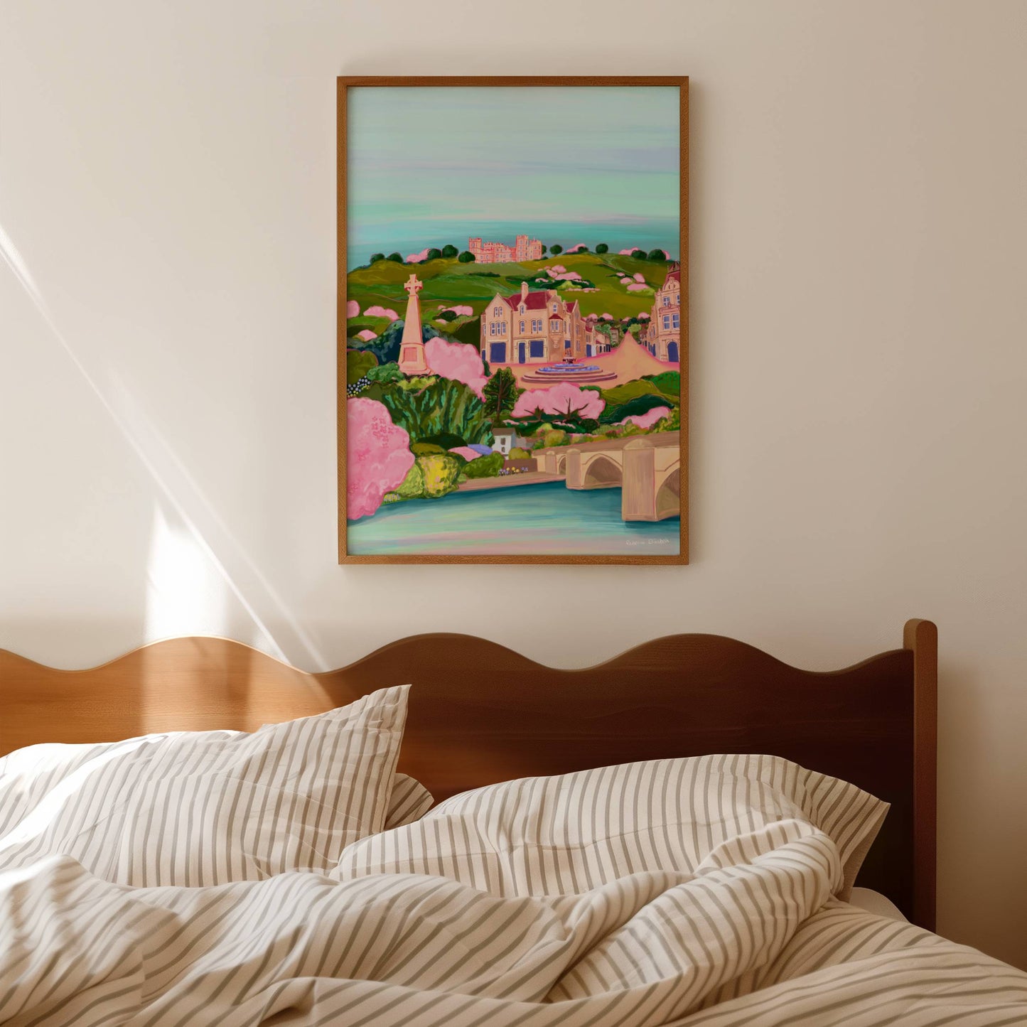 Colourful hand drawn illustration of matlock Derbyshire. Featuring riber castle, river Derwent, crown square, Pic Tor War Memorial, the duke william pub. All set against green hills in Rebecca Elizabeth draws signature style.