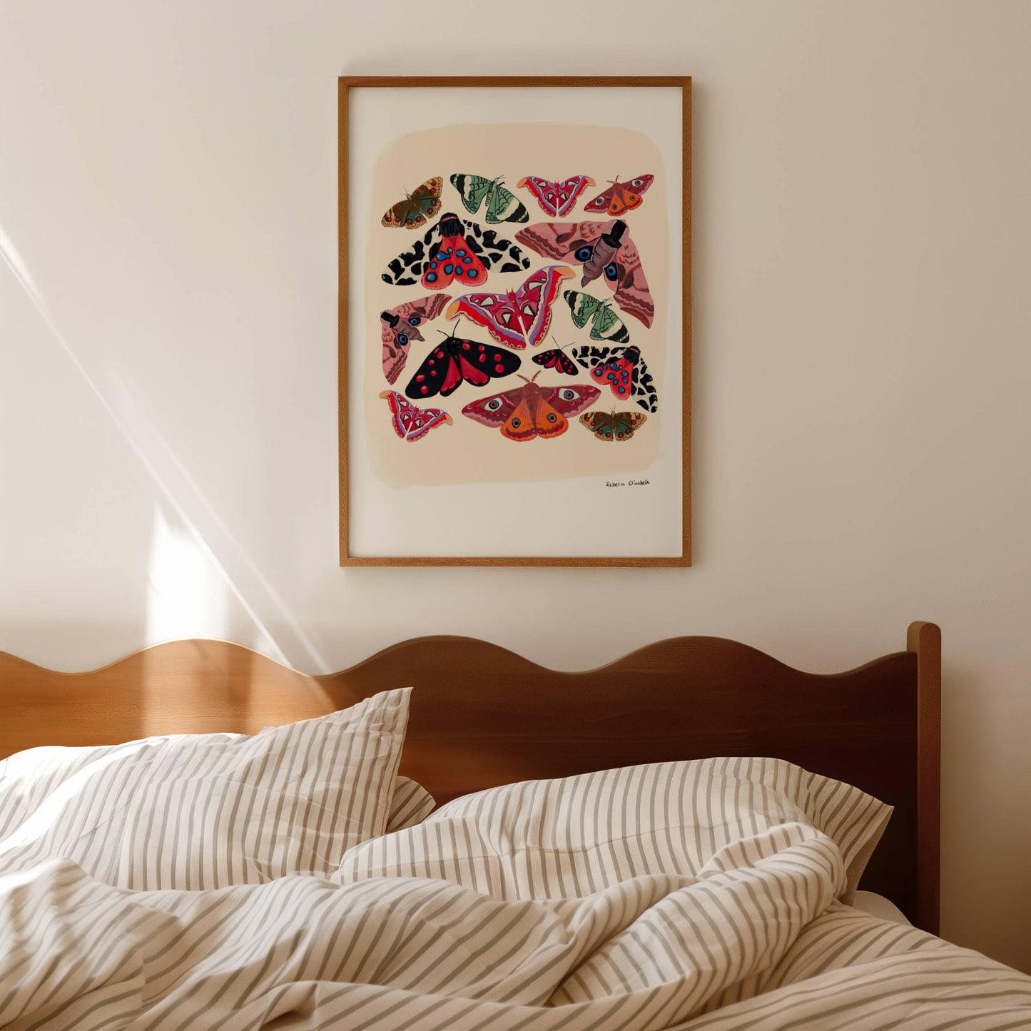 Colourful moths; an atlas moth, garden tiger moth, emperor moth and more. Bright and wonderful butterflies and moths of the world, painted in gouache and edited digitally on procreate into a collaged design on a cream background with a small signature underneath. There is a small signature in black at the right. Designed by Rebecca Gibbs at Rebecca Elizabeth Draws.