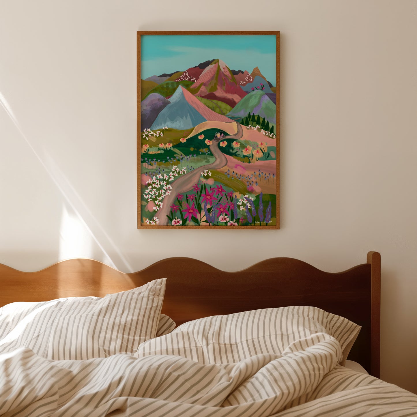 An illustration of a bike ride through the mountains. Fields of flowers in shades of green, pink, lilac, white and more. A winding path taken by the bicycle to the bottom of the mountains and then rolling mountains in lots of colours. These are muted but colourful rainbow mountains. There is a small signature in white the corner. Designed by Rebecca Gibbs at Rebecca Elizabeth Draws.