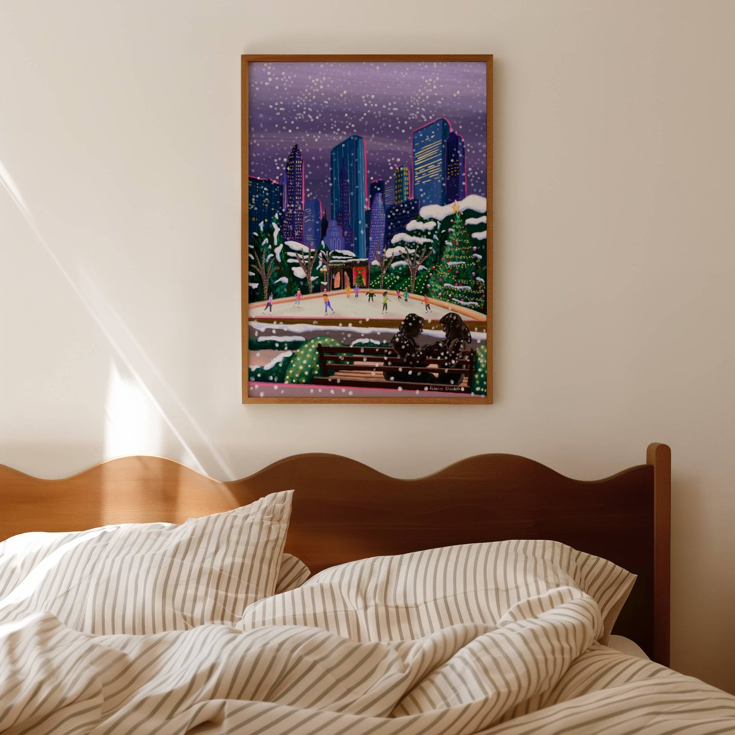 Christmas Illustration inspired by the film Serendipity. The main stars are silhouetted at the front of this illustration with the new York skyline behind them, at the base of the high rise buildings are Christmas trees, the serendipity shop and an ice skate rink with people on. Designed by Rebecca Gibbs at Rebecca Elizabeth Draws.