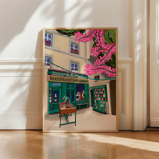 Illustration of Shakespeare and company bookshop in Paris France. with books for sale outside, and a pink cherry blossom tree in the foreground.