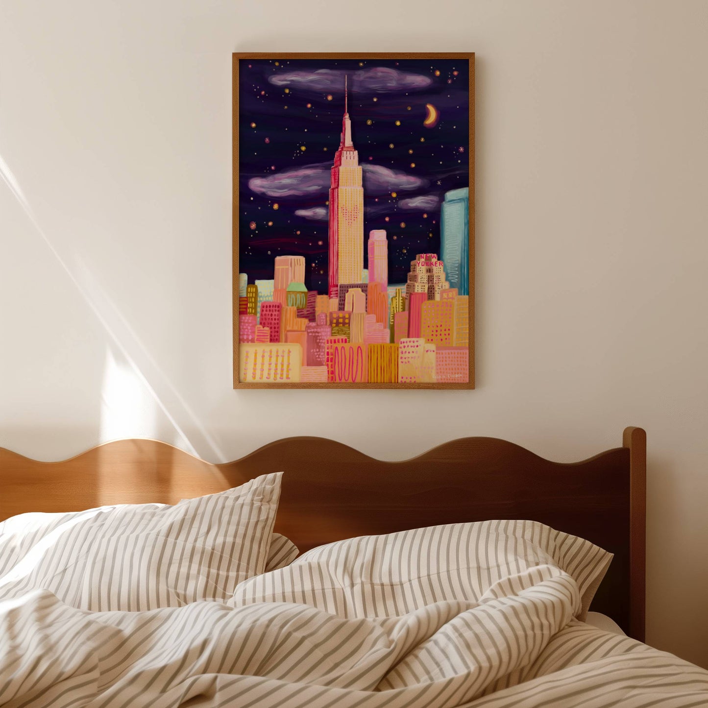 New York city skyline with the empire state building in the centre with love heart lights from the film sleepless in seattle with Meg Ryan & Tom Hanks. An evening night sky with stars sparkling, skyscraper buildings in the front in shades of pink & orange.