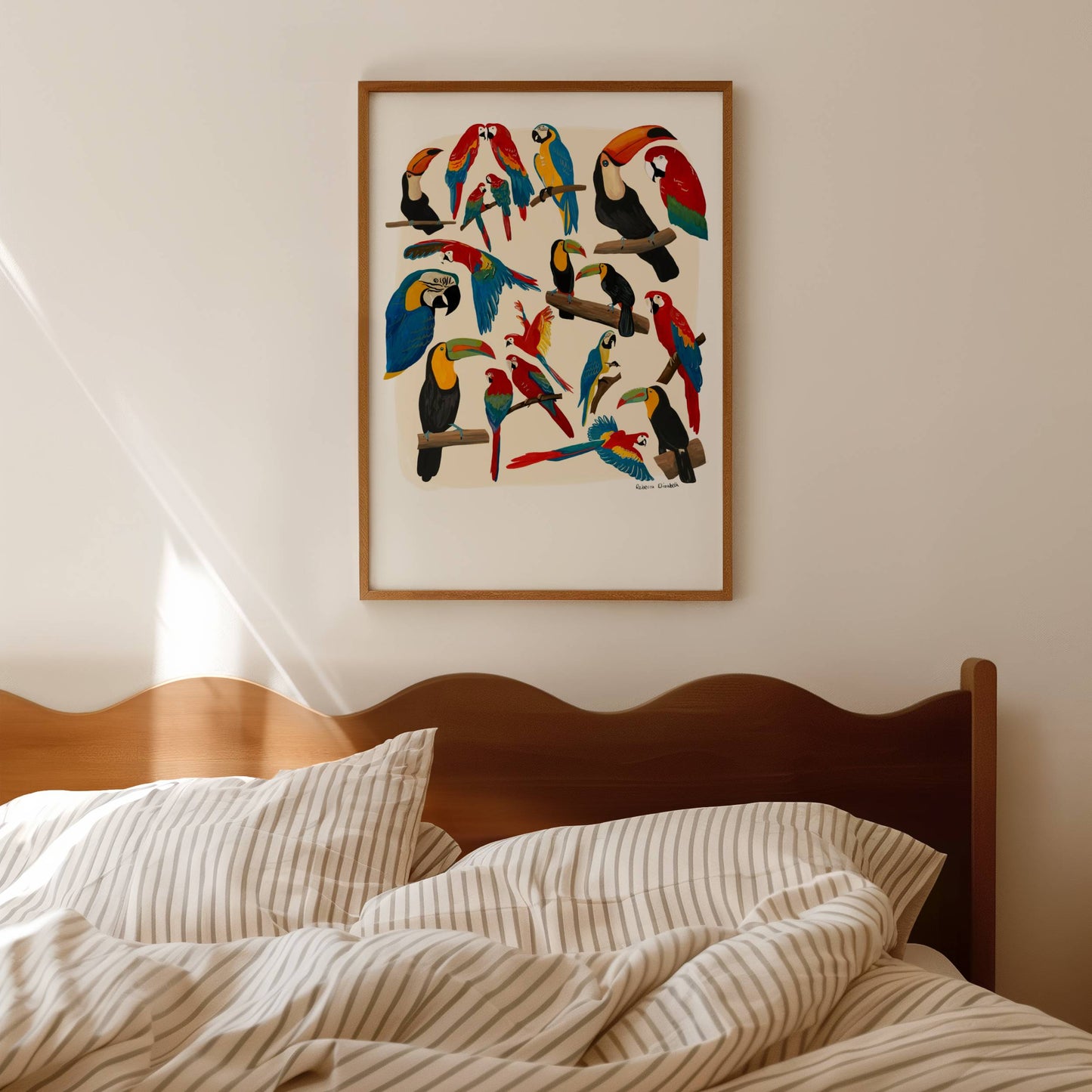 A collection of hand painted rainforest birds (parrot and toucan) in gouache and edited digitally into a collaged design on a cream background and a small signature underneath. Designed by Rebecca Gibbs at Rebecca Elizabeth Draws.