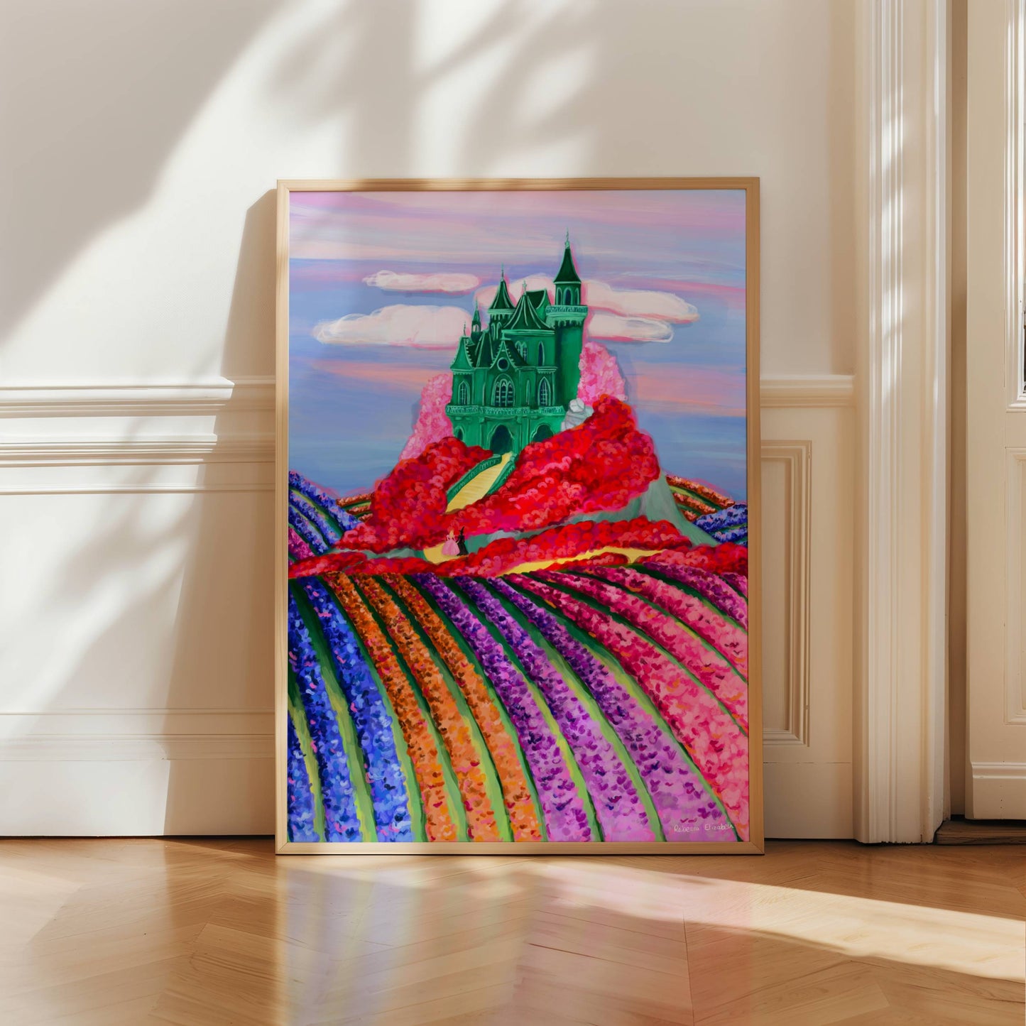 Illustration of the Emerald City in the Land of Oz with a whimsical green castle on top hill surrounded by red & pink poppies & fields of tulips down below. You can even spot the yellow brick road leading to this fantastical building.