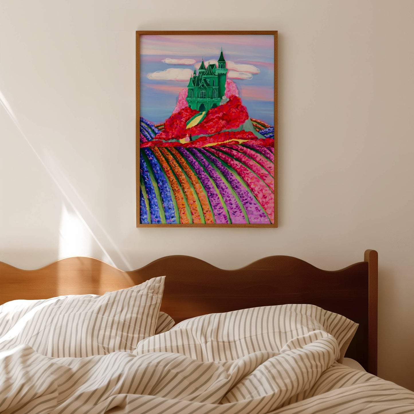Illustration of the Emerald City in the Land of Oz with a whimsical green castle on top hill surrounded by red & pink poppies & fields of tulips down below. You can even spot the yellow brick road leading to this fantastical building.