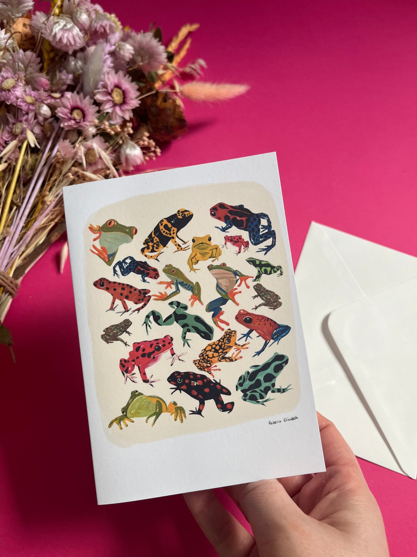 A collection of vibrant froggies to bring a pop of colour to your life. Hand painted rainforest frogs in gouache & edited digitally into a collaged design on a cream background & a small signature underneath. On a cream background with a green & logo