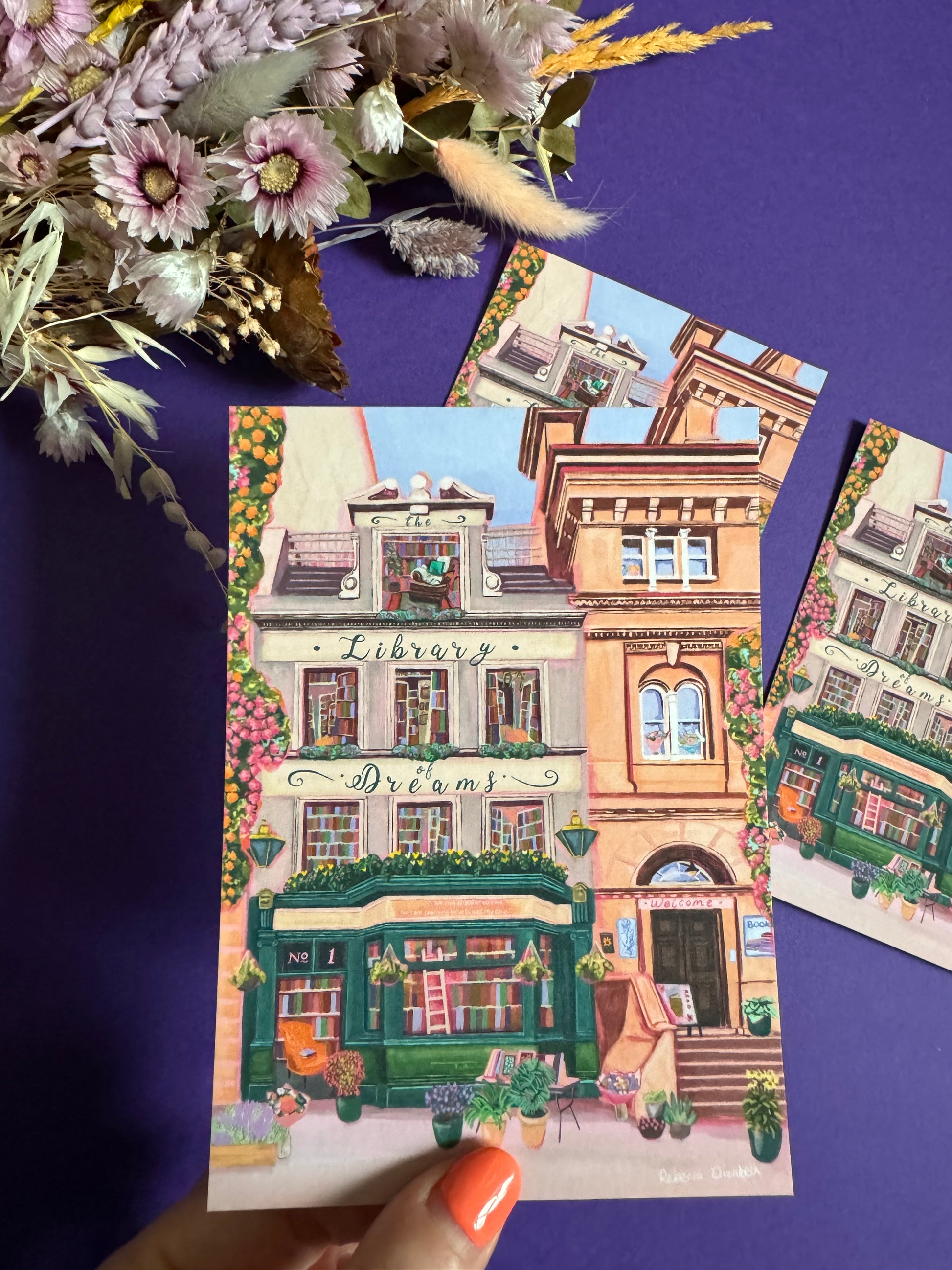 4 storey town house library with windows showing bookcases stacked full of books, covered with flowers & plants. A fantasy library perfect for cosying up with a good book designed by Rebecca Elizabeth Draws