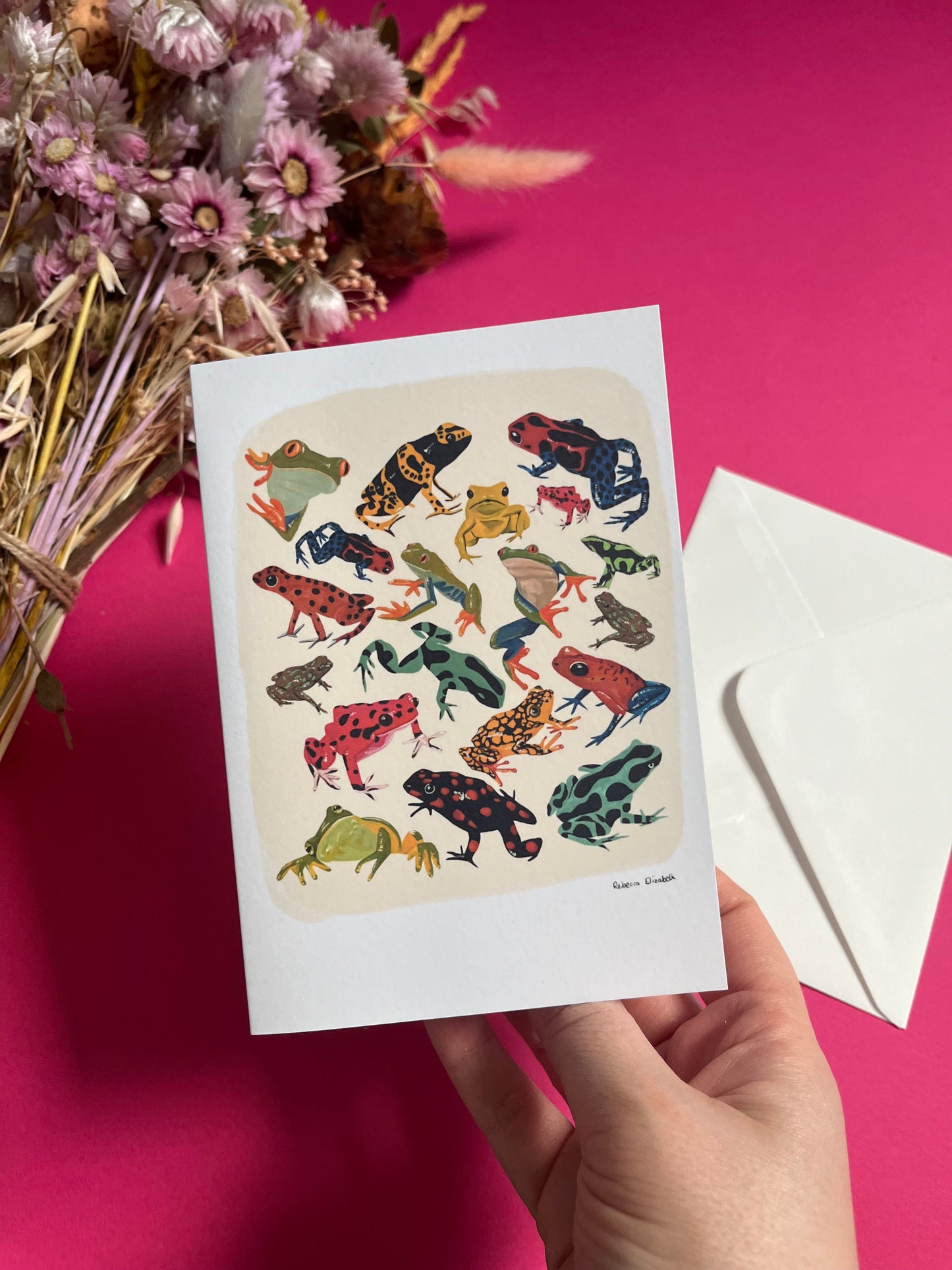 A collection of vibrant froggies to bring a pop of colour to your life. Hand painted rainforest frogs in gouache & edited digitally into a collaged design on a cream background & a small signature underneath. On a cream background with a green & logo