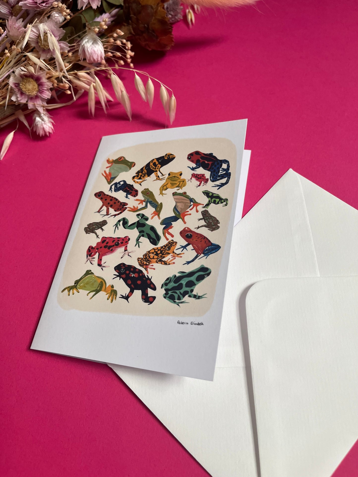 A collection of vibrant froggies to bring a pop of colour to your life. Hand painted rainforest frogs in gouache & edited digitally into a collaged design on a cream background & a small signature underneath. On a cream background with a green & logo