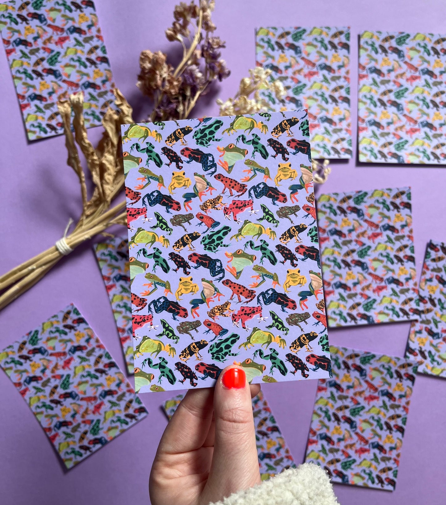 A pattern of vibrant froggies to bring a pop of colour to your life. Hand painted rainforest frogs in gouache and edited digitally into a pattern on a purple background. Now available in a cute postcard.