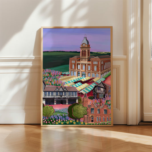 Chesterfield market town in Derbyshire illustration. A colourful market hall, winding wheel theatre, museum & towns oldest pub the royal oak are all illustrated with pink highlights whilst staying true to their authentic colours. The foreground is full of flowers, & the buildings lay against fields of green & a purple sky. 
