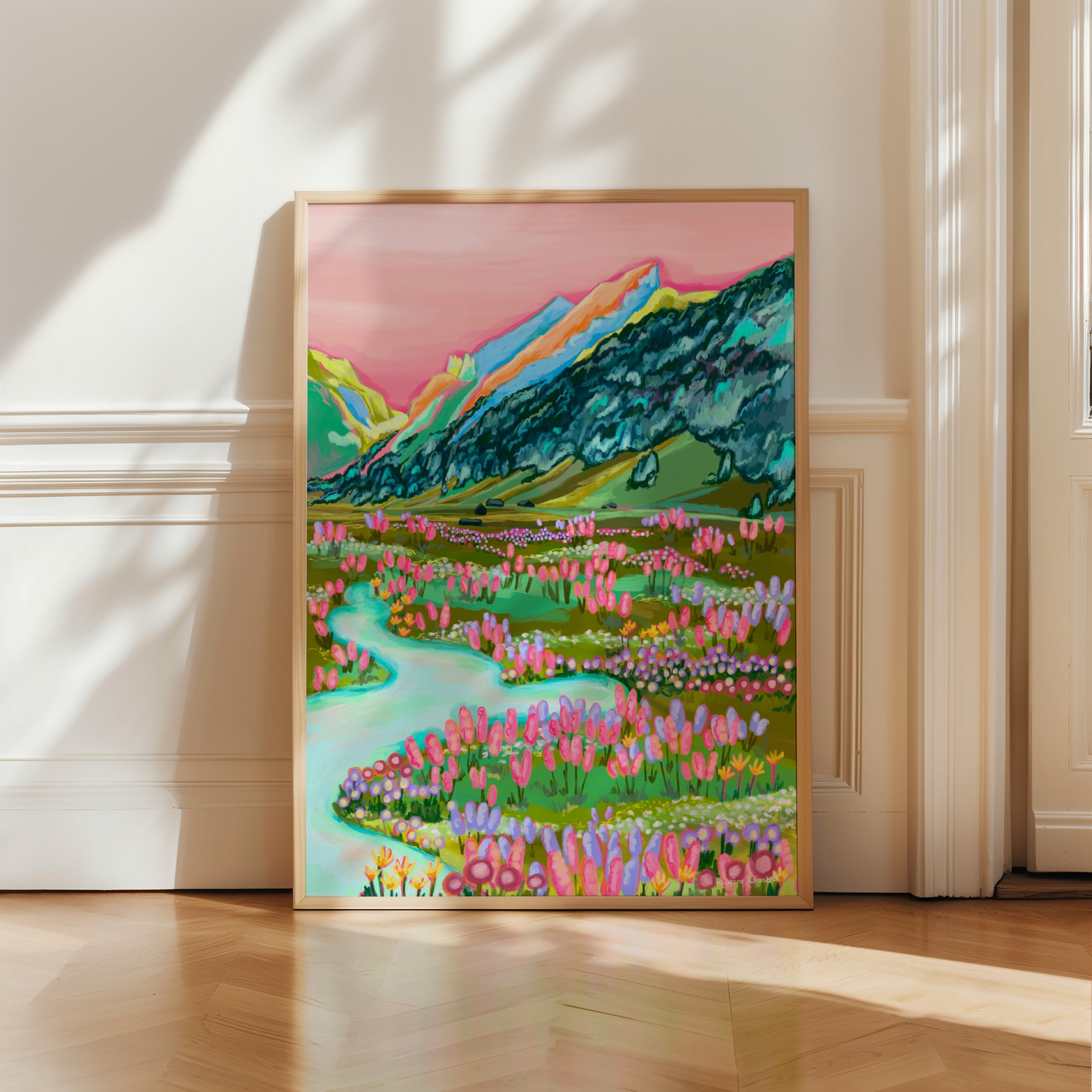 An illustration inspired by the swiss alps of mountains in green, yellow, orange and pink with a coral sky and lots of trees climbing the sides in dark teal. At the base of the hill are cabins, a river and lots of wild flowers growing. Designed by Rebecca Elizabeth Draws