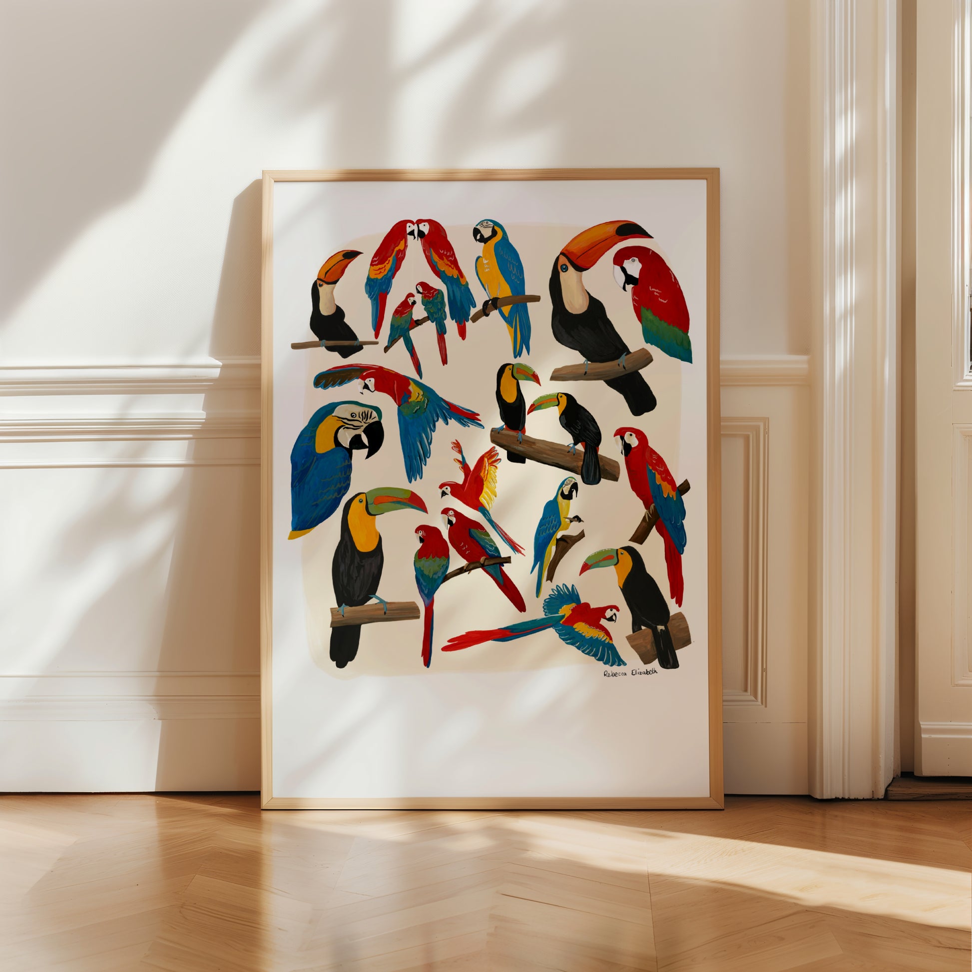 A collection of hand painted rainforest birds (parrot and toucan) in gouache and edited digitally into a collaged design on a cream background and a small signature underneath. Designed by Rebecca Gibbs at Rebecca Elizabeth Draws.