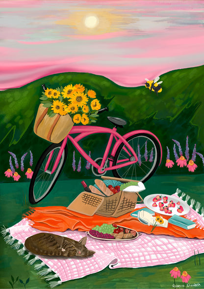 An illustration of a pink bicycle resting up by a picnic blanket filled with wine, loaves of bread, strawberries, picked sunflowers and a book. There is a cat sleeping and behind is pink and purple flowers against the greenery. There is a bumble bee and the sky is pink and grey with a small yellow sun. There is a small signature in white the corner.  Designed by Rebecca Gibbs at Rebecca Elizabeth Draws.