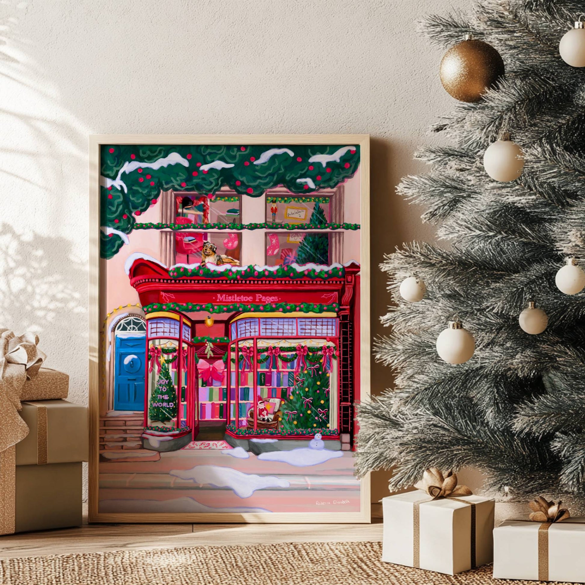 A Christmas bookshop store front illustration in red with soft whimsical colour books, festive decorations & a look upstairs inside the window at a cosy home with a dog. There is snow fallen around & a festive holly & berry tree hanging over the top