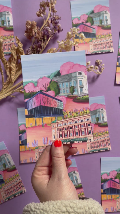 Sheffield theatres illustration, Crucible and Lyceum theatre are illustrated alongside Sheffield library on a background of pink and orange. Trees in both green and pink surround and a baby blue sky. Now available in a cute postcard designed at Rebecca Elizabeth draws. 