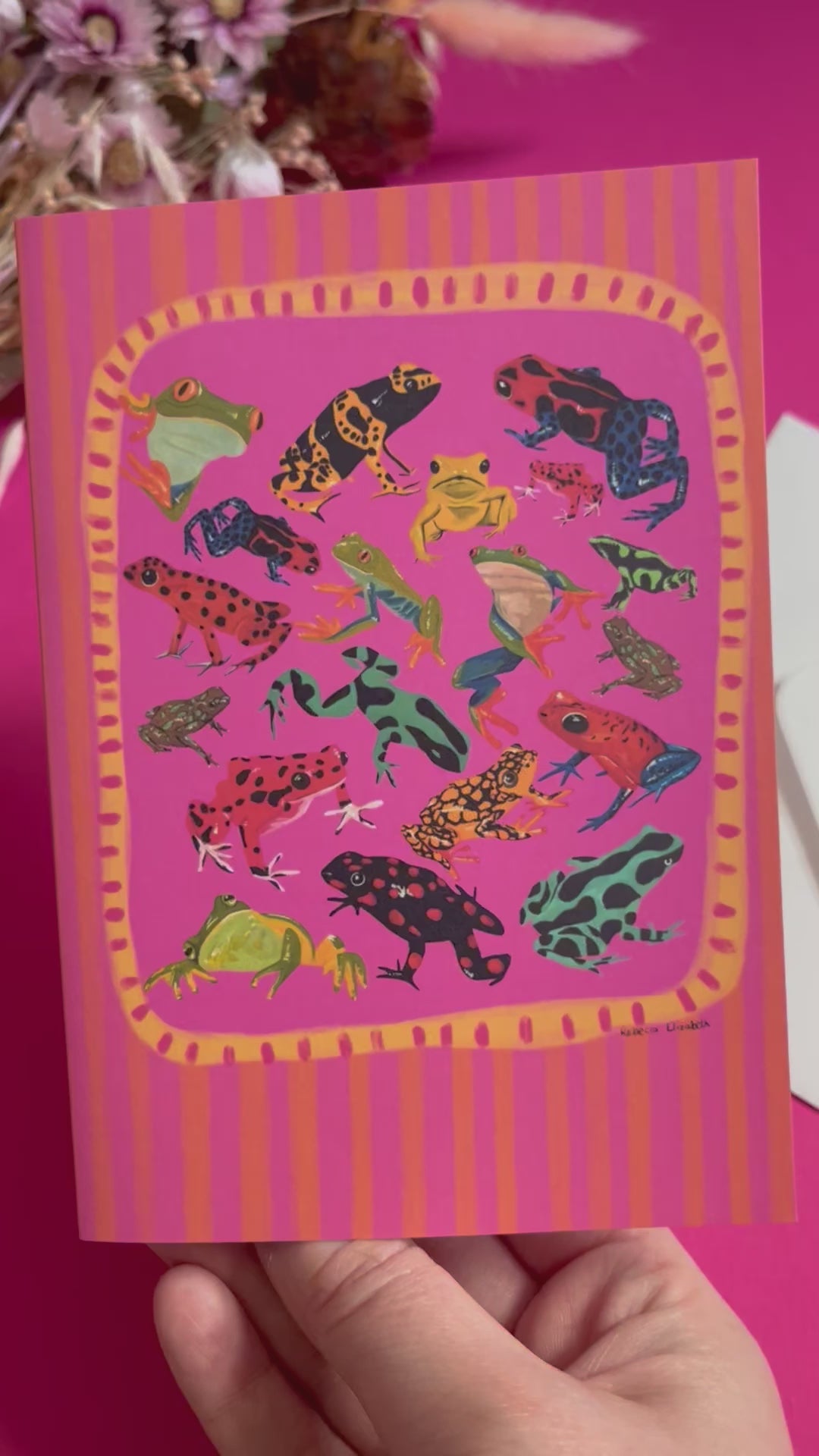 A collection of vibrant froggies to bring a pop of colour to your life. Hand painted rainforest frogs in gouache and edited digitally into a collaged design on a vibrant pink & red background. The back of the card has the Rebecca Elizabeth Draws logo