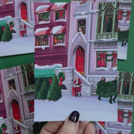 Christmas Illustrated postcard inspired by the film When Harry Met Sally. With Harry & Sally running off with their Christmas tree at the right hand side, the tree shop to the left and a background of new York buildings with Christmas décor peaking out the windows. Designed by Rebecca Gibbs at Rebecca Elizabeth Draws.