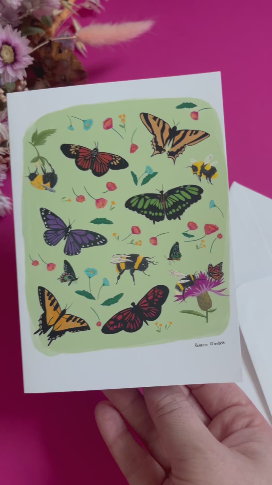 A collection of wildflowers, bumblebees and butterflies hand painted in gouache and edited digitally into a collaged design on a light green background. With a green back and the Rebecca Elizabeth Draws logo.  