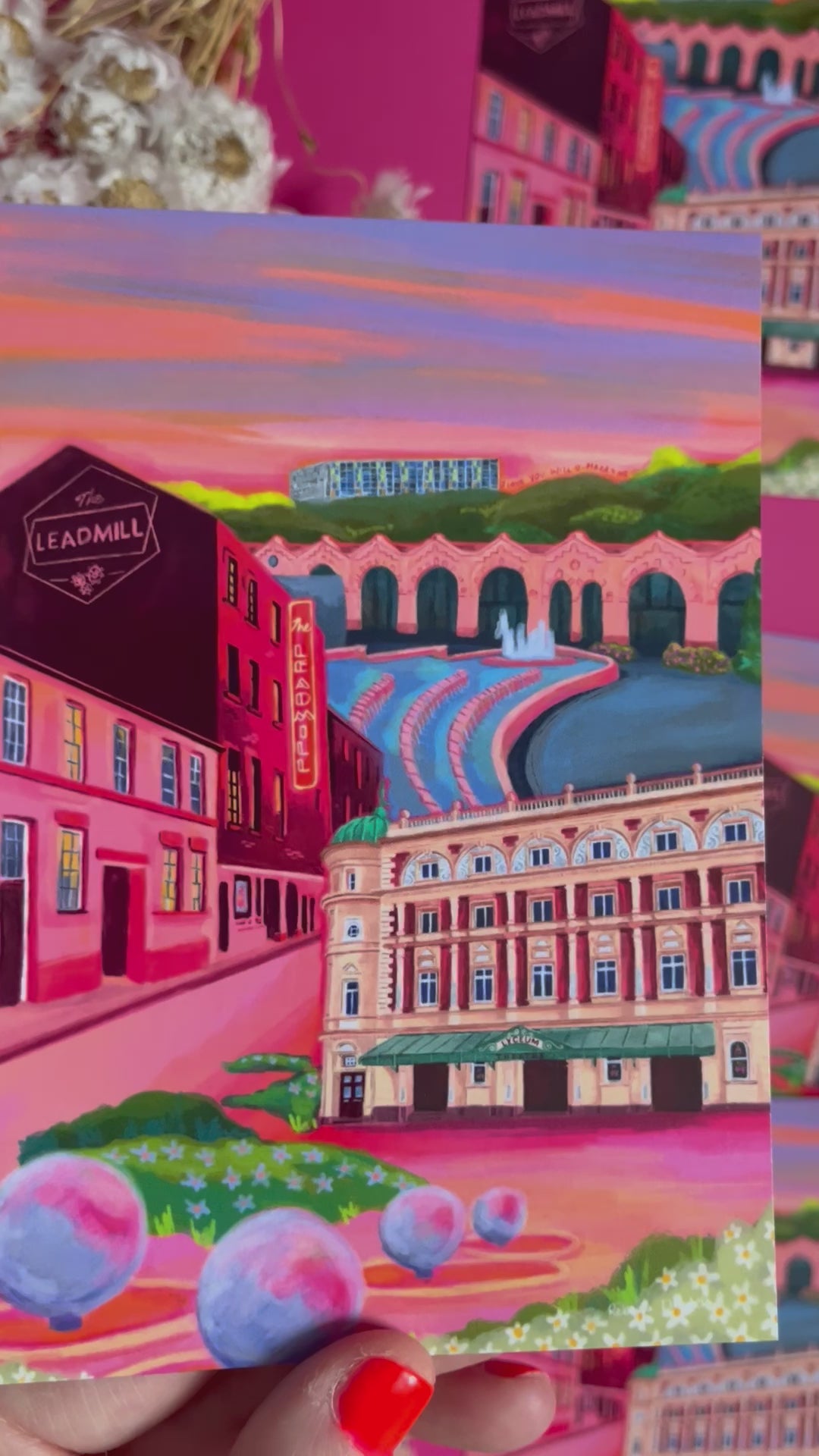 video of Postcard of an illustration of the Sheffield city with The Lyceum theatre, The Leadmill venue, the train station, park hill flats & graffiti. Designed by Rebecca Elizabeth Draws. Vibrant pinks, purples and oranges are featured. 