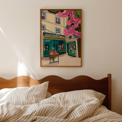 Illustration of Shakespeare and company bookshop in Paris France. with books for sale outside, and a pink cherry blossom tree in the foreground.