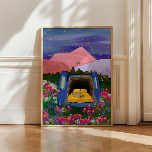An illustration depicting camping in your van under the stars. The van doors are open at the back revealing a curled up dog and fairy lights around the outside. The field it sits on is full of flowers, butterflies and bumblebees. There is a pink, red and purple mountain behind and then a night sky full of stars. There is a small signature in white the corner.  Designed by Rebecca Gibbs at Rebecca Elizabeth Draws.